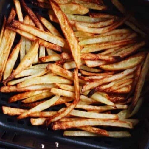 Cooked french fries in air fryer basket