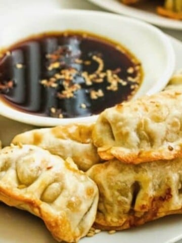 Air Fryer Dumplings with Sauce on a white plate