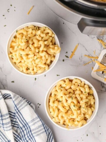 Overhead view of two bowls full of macaroni and cheese