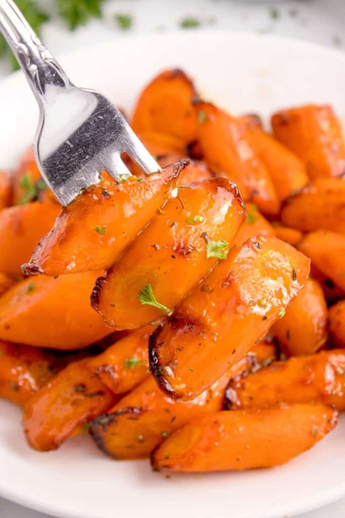 Air fryer carrots cooked and picked up with a fork