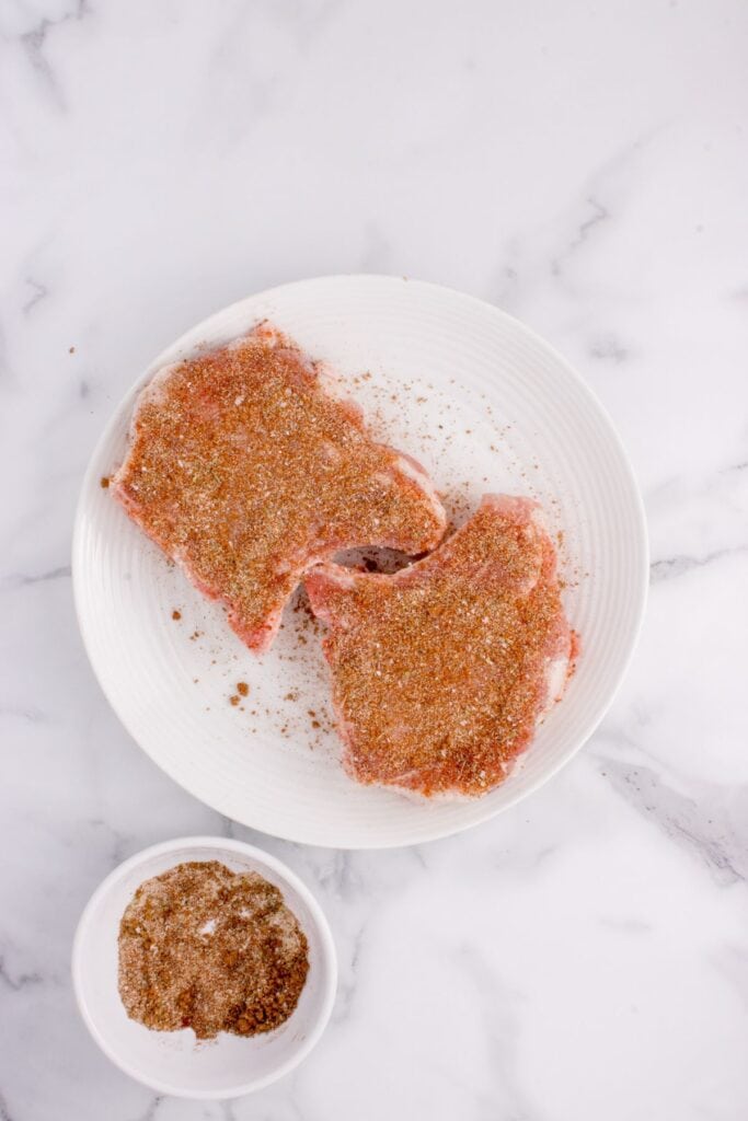 Seasoned pork chops about to be air fried.