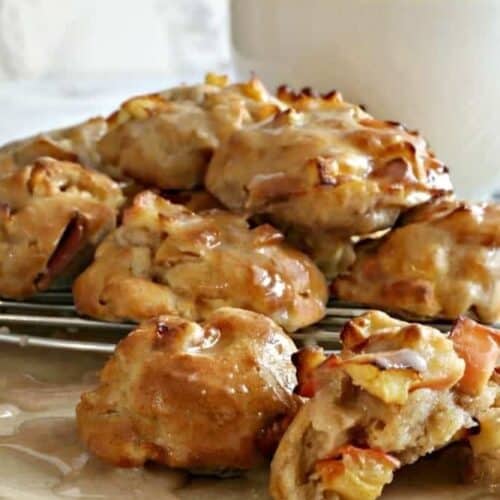 Air Fryer Apple Fritters on a wire rack with a white mug