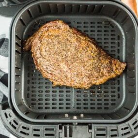 Cooked steak inside air fryer