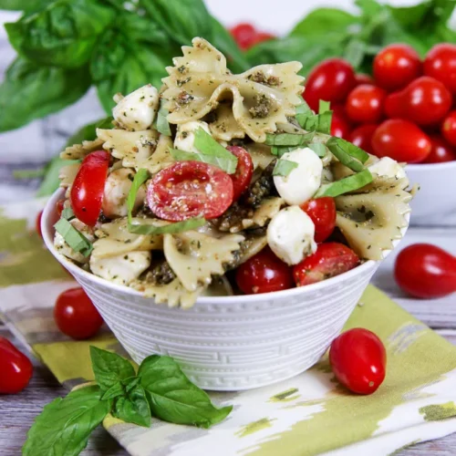 an easy lunch with caprese pasta salad in a white bowl.