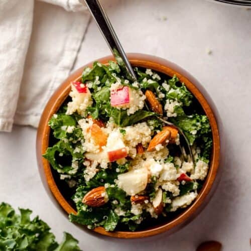 Quinoa salad with apples served in a wooden bowl as a easy lunch idea.