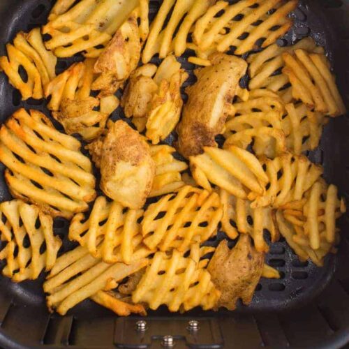 Close up of Waffle Fries in the Air Fryer basket