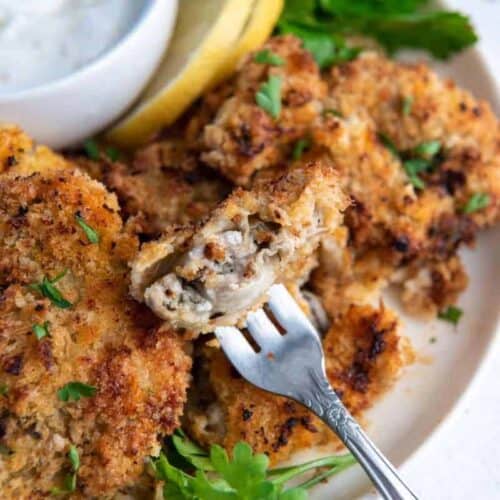 Crispy air fryer oysters on serving plate with fork