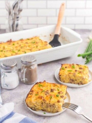 hash brown casserole in 9 by 13 dish with two plates with servings