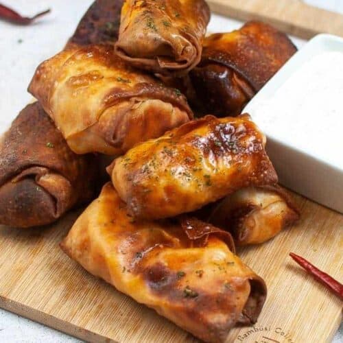 Stack of air fryer buffalo chicken egg rolls