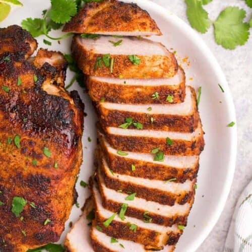 Thick pork chop cooked in air fryer in slices with cilantro lime seasoning