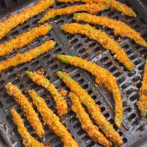 close up of green bean fries in air fryer