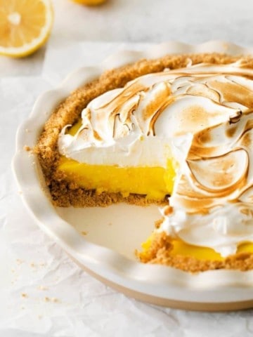 lemon meringue pie with piece taken out