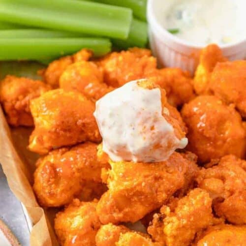 cauliflower wings dipped in sauce