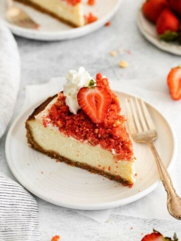 piece of strawberry crunch chesecake on plate