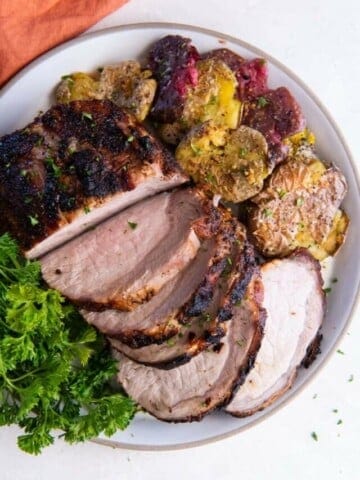 platter with pork roast and vegetables