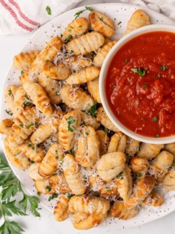 gnocci on platter with sauce