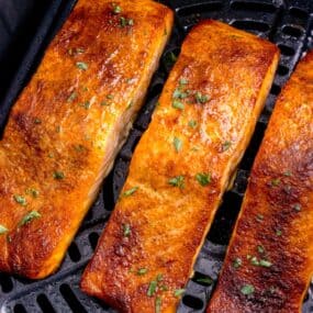 Closeup of cooked salmon in the air fryer.