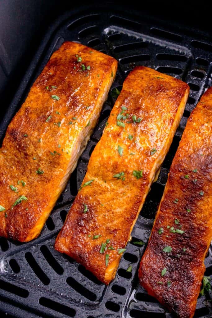 Closeup of cooked salmon in the air fryer.