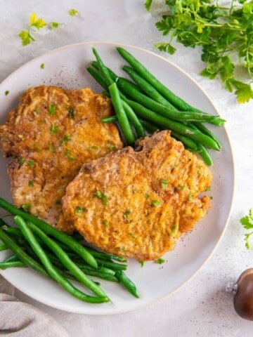 plate with pork chops and green beans