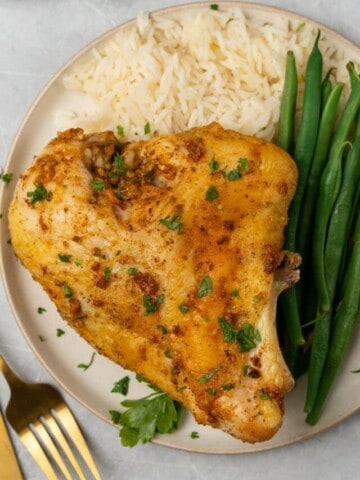 plate with baked chicken breast and green beans