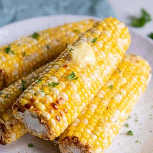 Four delicious ears of corn prepared from frozen in an air fryer.