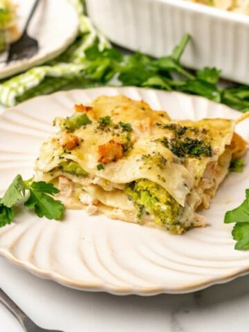 Chicken and Broccoli Lasagna on an off white plate.