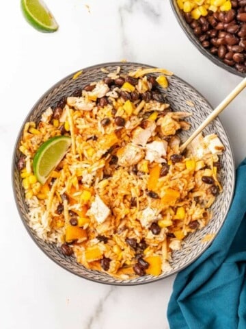 Overhead view of Southwest Bowls in a gray bowl with a spoon.