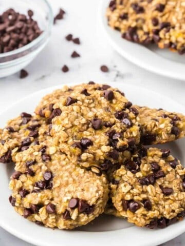 Several oatmeal chocolate chip banana cookies on a dessert plate.