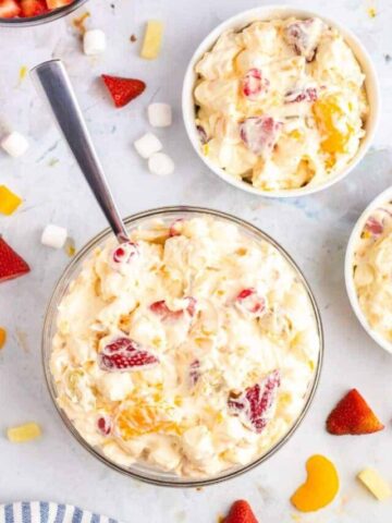 cool whip fruit salad in 3 bowls.