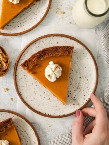 An overhead view of sweet potato pie topped with whipped cream.