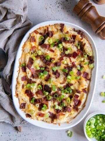 Baked twice baked mashed potatoes in a baking dish ready to be served.