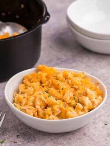 a bowl of cheesy air fryer macaroni and cheese.