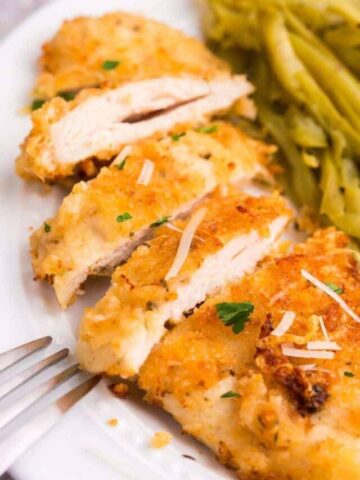 close up of sliced parmesan chicken in the air fryer