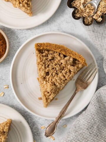 top view of a slice of apple pie with a crumbly topping