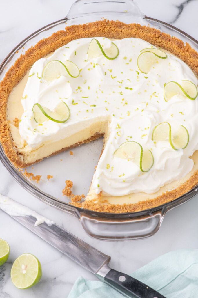 cutting a slice of lime pie 