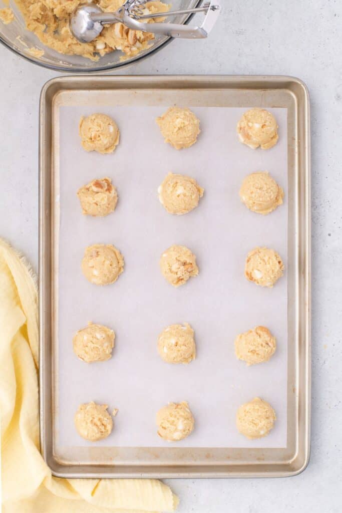 rolled pudding cookie dough balls on a sheet pan