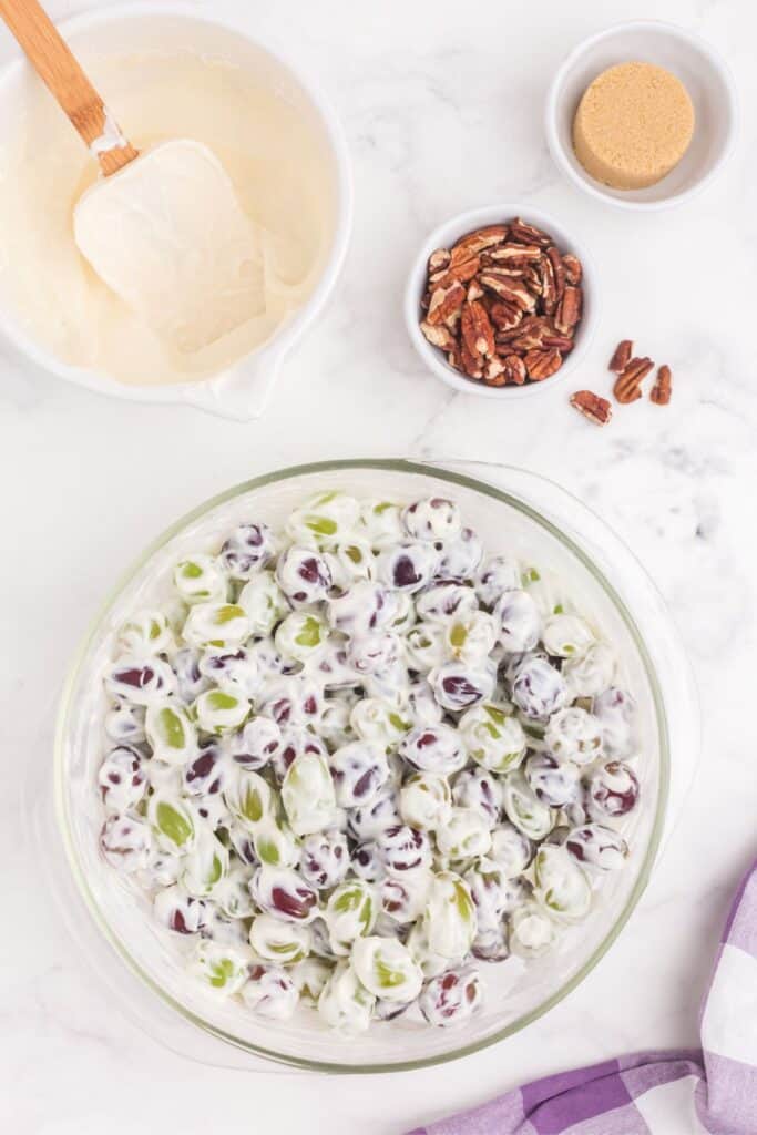 mixing fresh seedless grapes with cream cheese