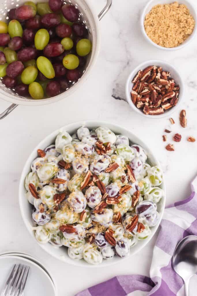 creamy grape salad topped with pecan pieces