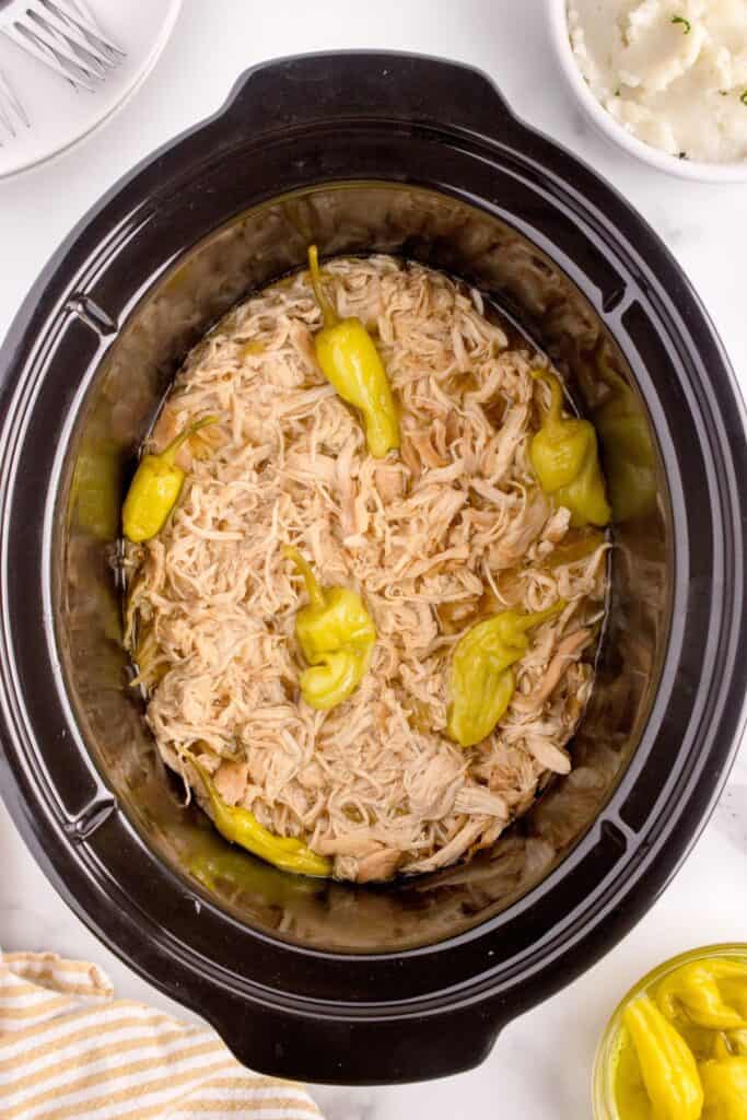 mississippi chicken in a crock pot with pepperoncini peppers