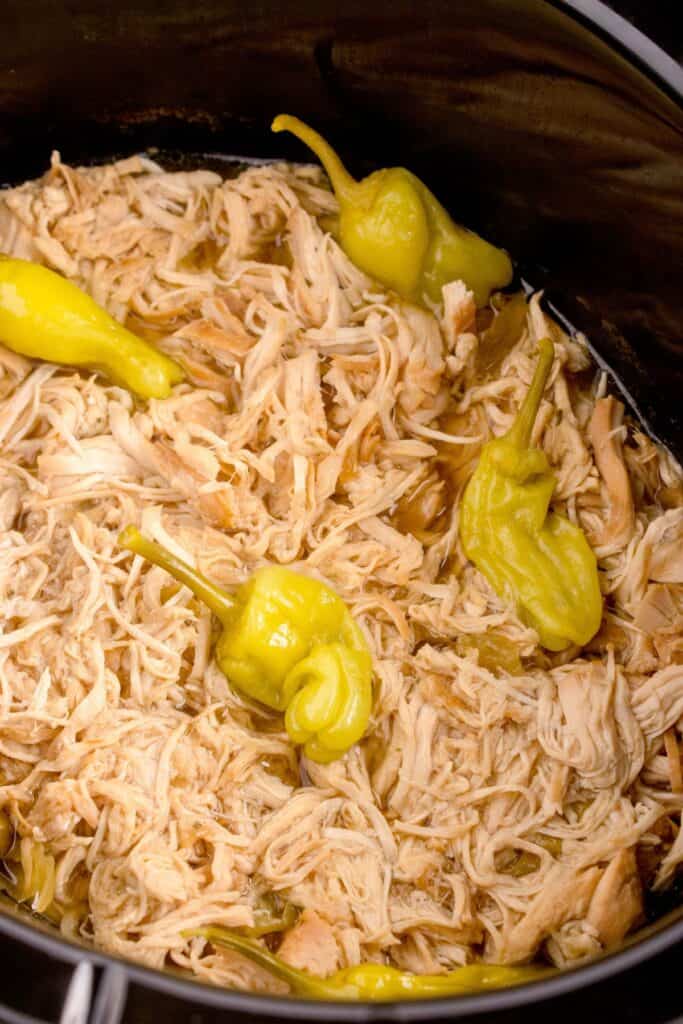 mississippi chicken in a slow cooker with pepperoncini peppers