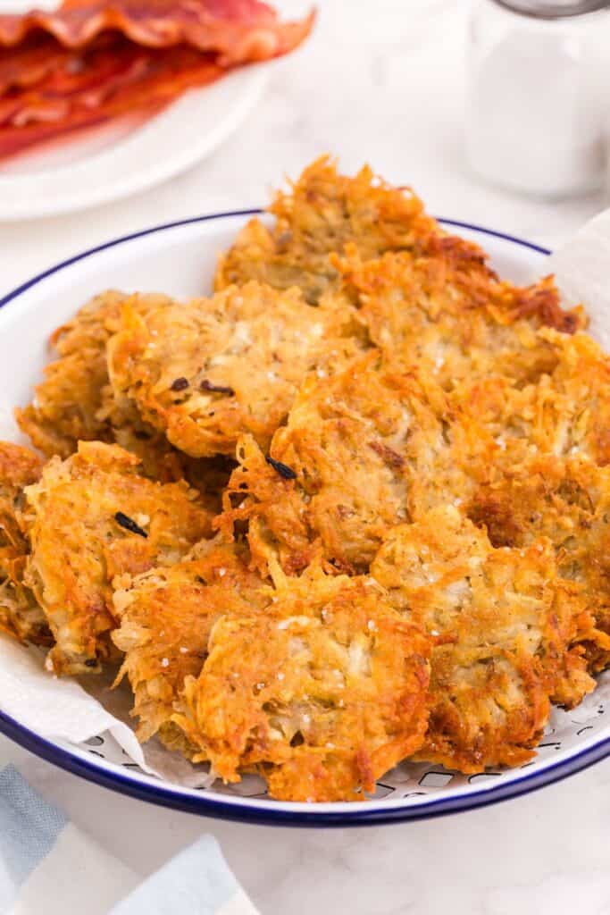 Large rustic platter of hash brown patties.