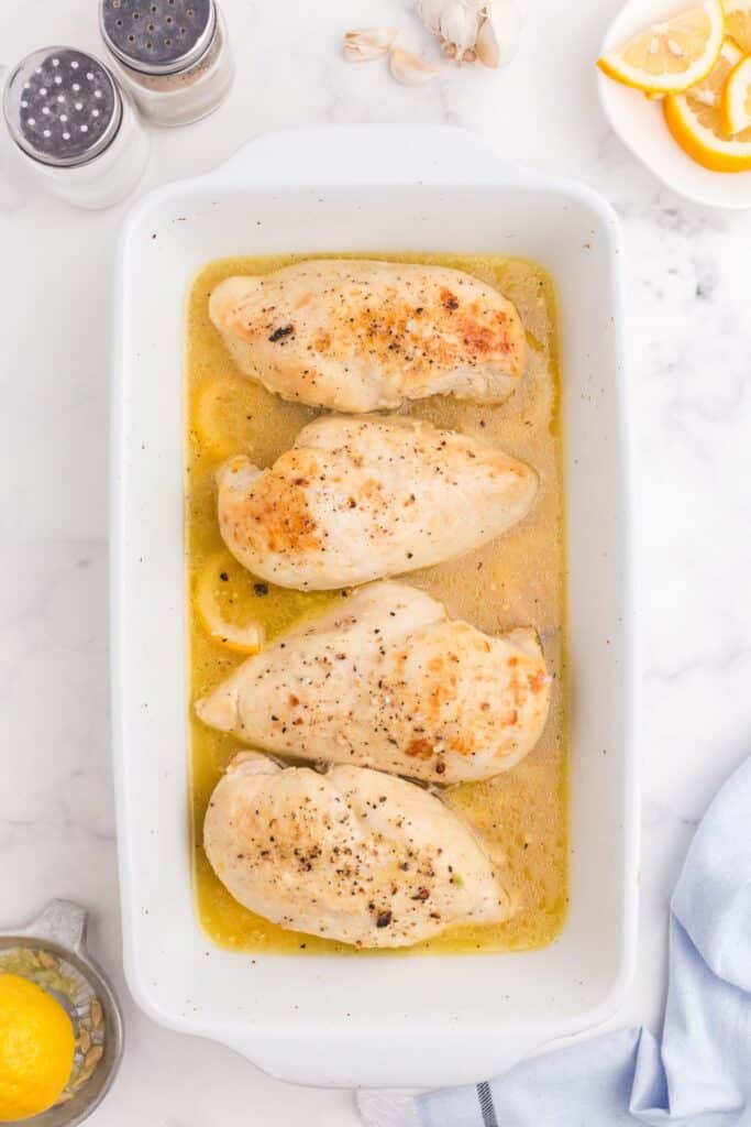 Cooked lemon chicken in a baking dish