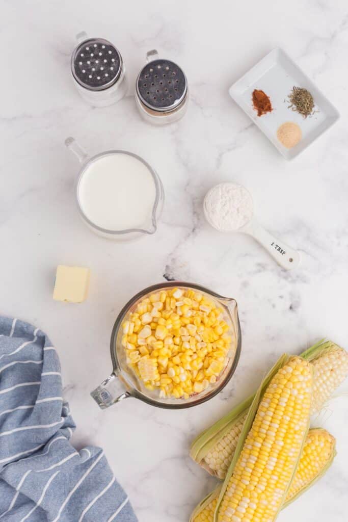 Ingredients for creamed corn: salt, pepper, sweet corn, butter, flour, half and half, cayenne, ground onion, and dried thyme.