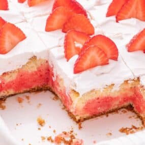 Sliced strawberry jello cake.