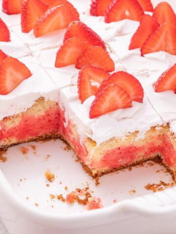 Sliced strawberry jello cake.