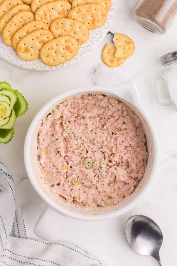 Ham salad in a white mixing bowl.