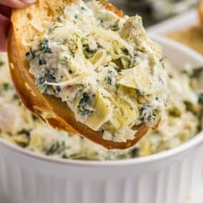 Baked spinach and artichoke dip on a crustini.