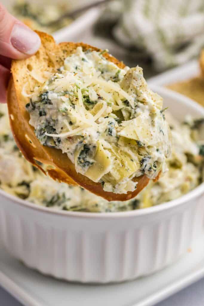 Baked spinach and artichoke dip on a crustini.