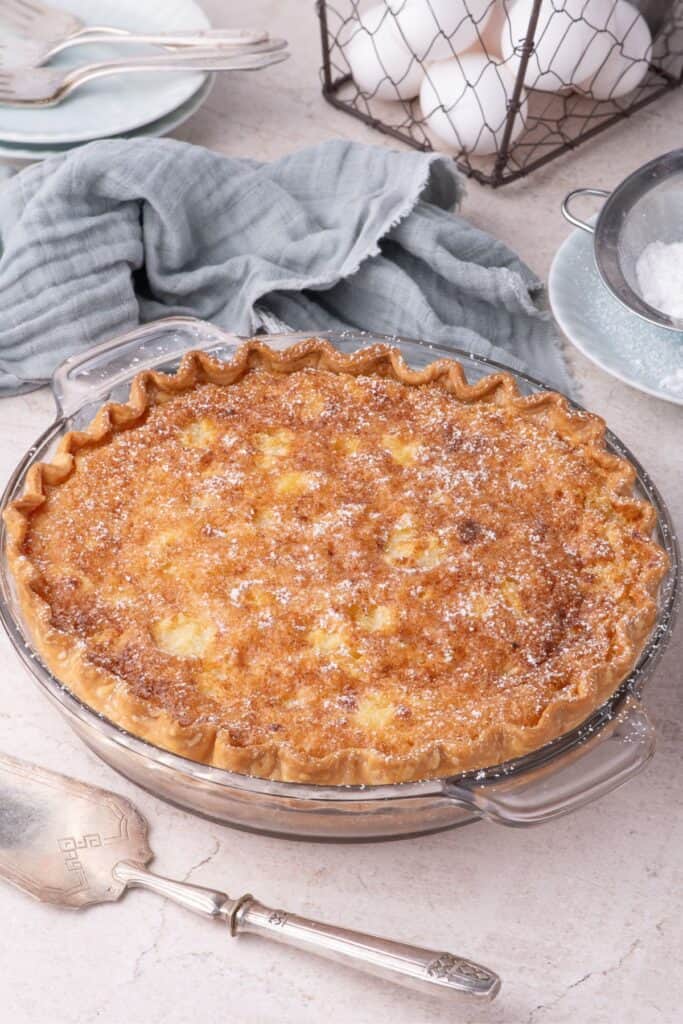 Completed chess pie with a dusting of powdered sugar on top.