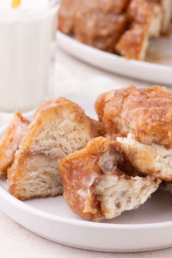 Completed and sliced monkey bread on a white plate.